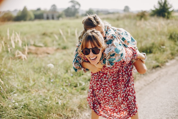 Cute and stylish family in a summer field