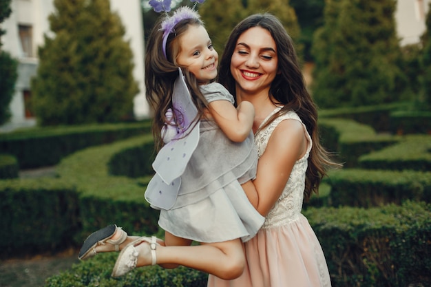 Cute and stylish family in a summer park