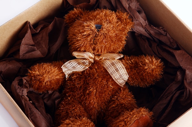 Free photo cute teddy bear in the gift box