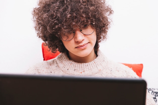 Cute teenager using laptop