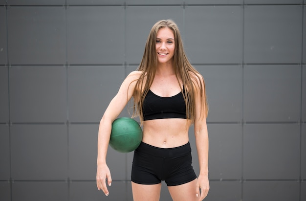 Cute woman doing fitness in outdoors