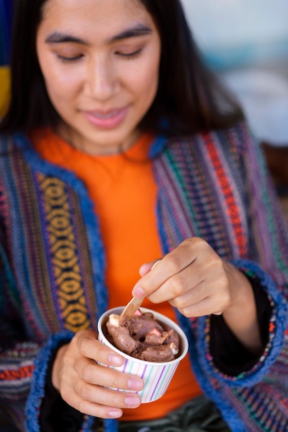 Free photo cute woman eating ice cream