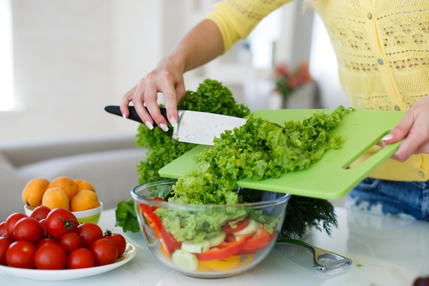 Free Photo cute woman at home with salad