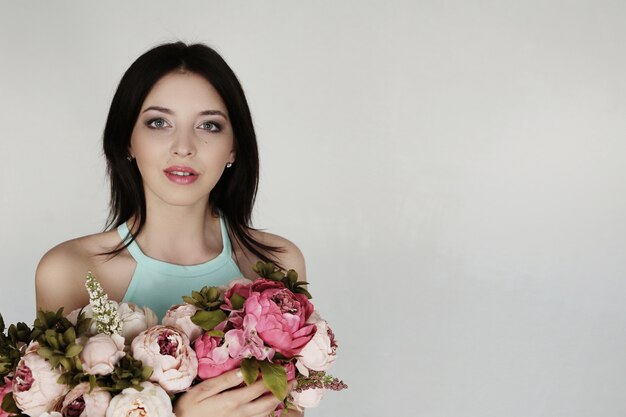 Cute woman with floral bouquet