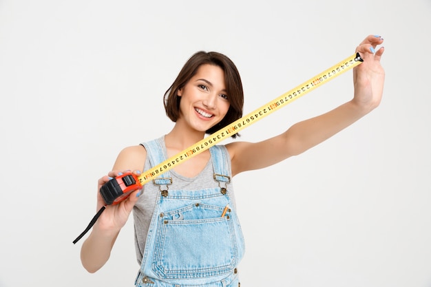 Free Photo cute woman with tape measure renovate house