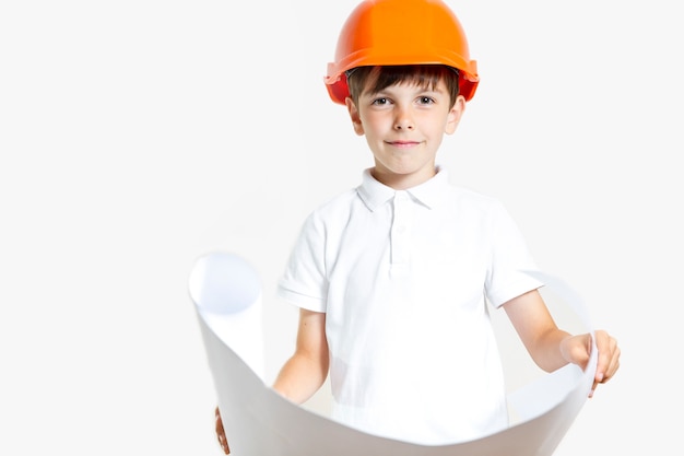 Free photo cute young boy with safety helmet