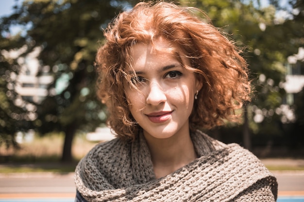 Cute young female in park