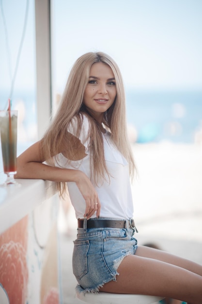 cute young woman in cafe terrace outdoor