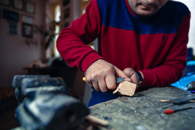 Free photo cutting useless pieces of wood to make art