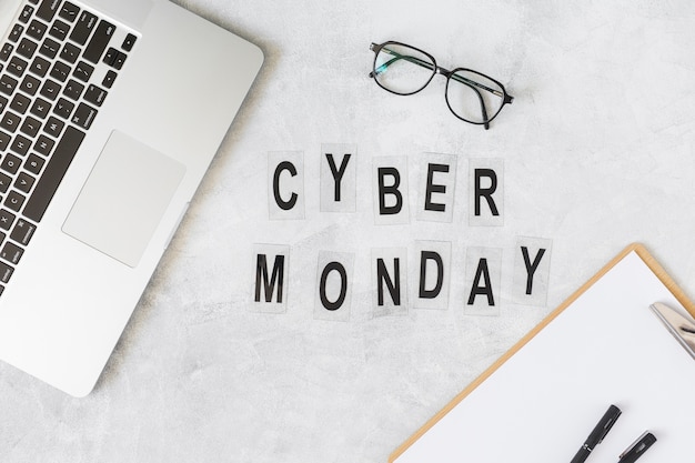 Free photo cyber monday inscription on table with laptop