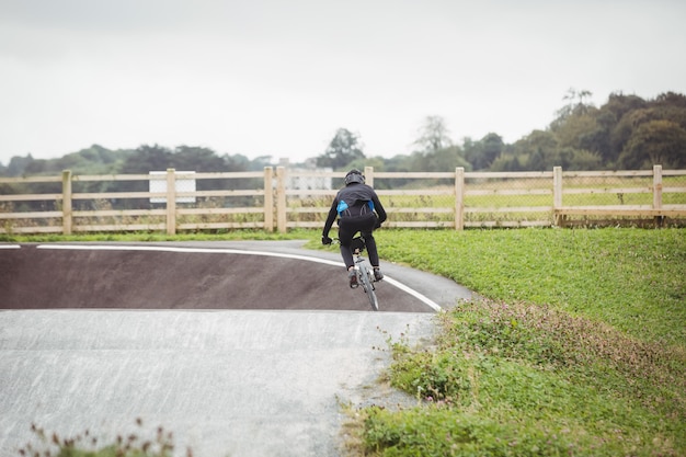 Cyclist riding BMX bike in skatepark