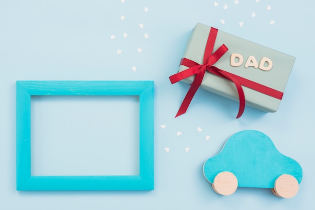 Dad inscription with gift box, small car and frame