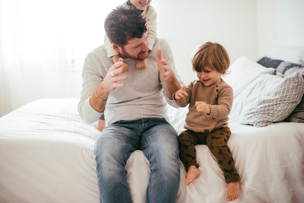 Dad playing with small boys