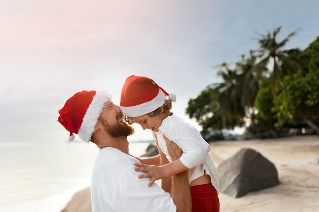 Dad and son celebrating christmas in july