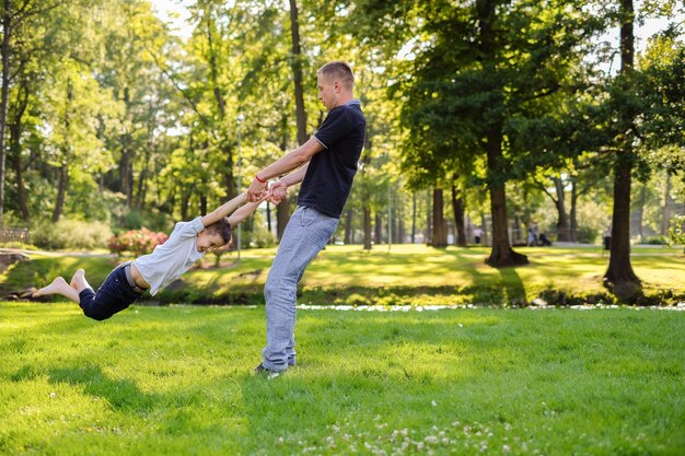 Dad and son playing in the park