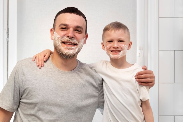 Free photo dad teaching his son how to shave