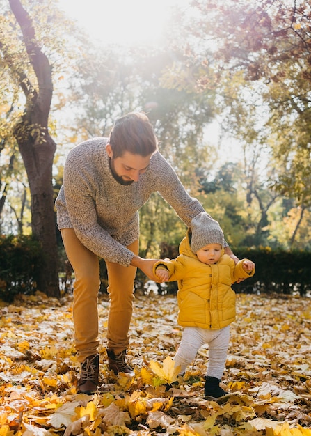 Free photo dad with his baby outdoors in nature