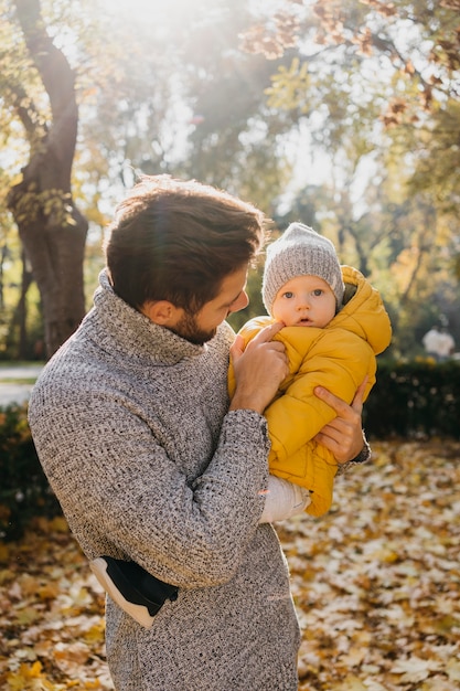 Dad with his baby outdoors