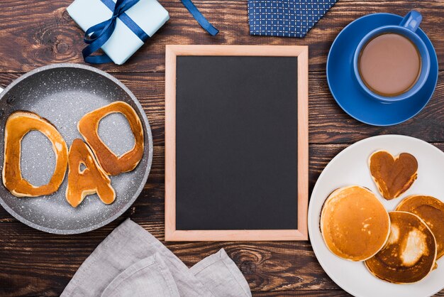 Dad word written in bread buns and copy space frame