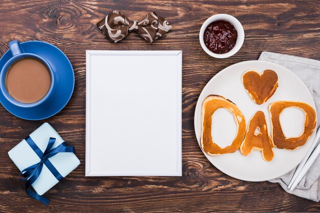 Dad word written in bread buns and notepad