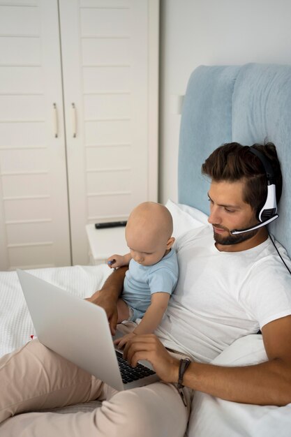 Dad working from home during quarantine with child