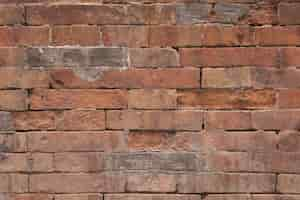 Free photo damaged brick wall texture