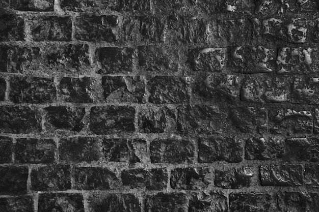 Free Photo dark aged brick wall