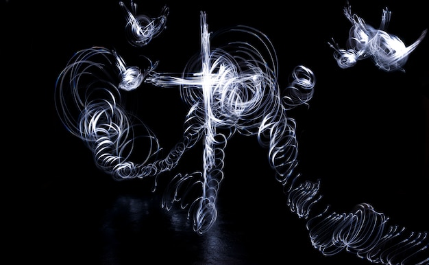 Free Photo dark background with abstract shiny cross