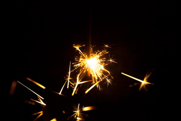 Dark background with decorative sparks