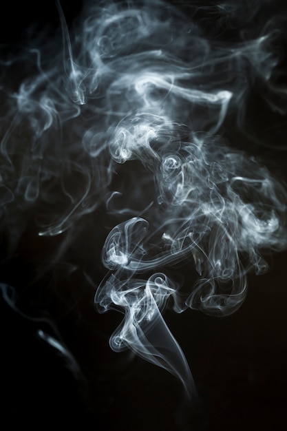 Dark background with dynamic smoke silhouette