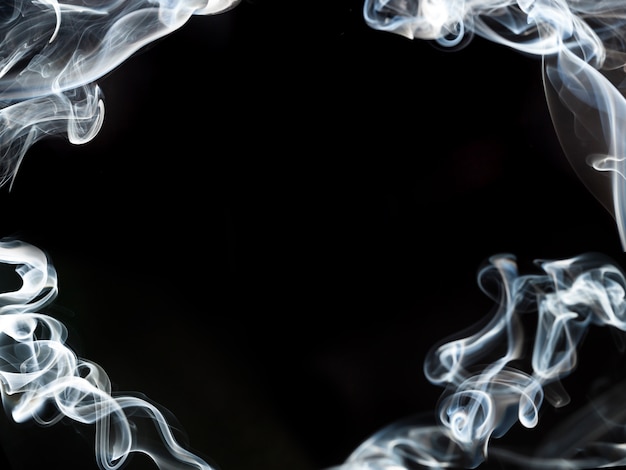 Free photo dark background with smoke frame