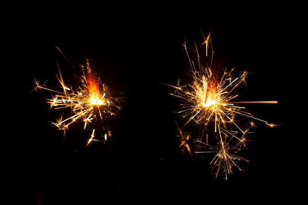 Dark background with two sparklers