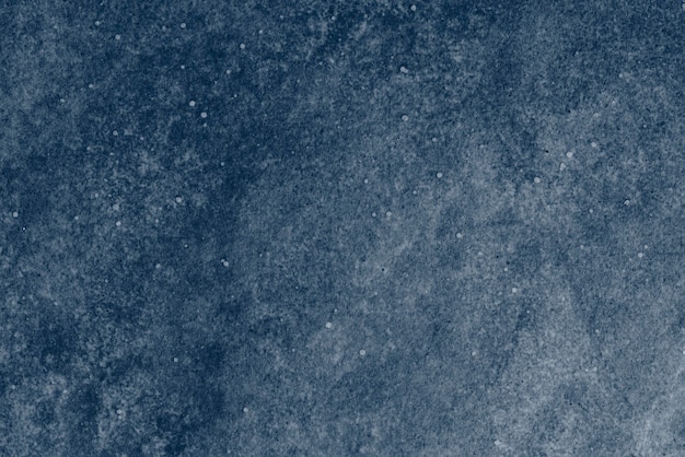 Free photo dark blue granite textured background