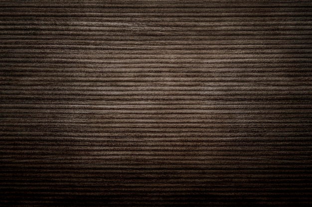 Dark brown corduroy fabric textured background