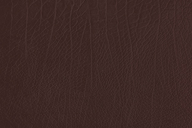 Free photo dark brown creased leather textured background