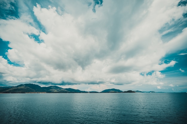 Dark cloud on sky with island