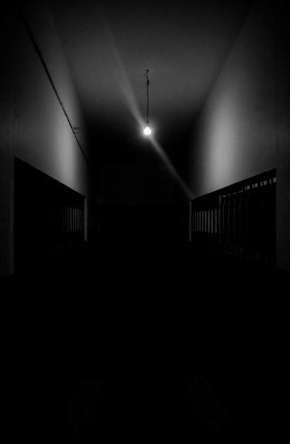 Free photo dark hallway with a single light