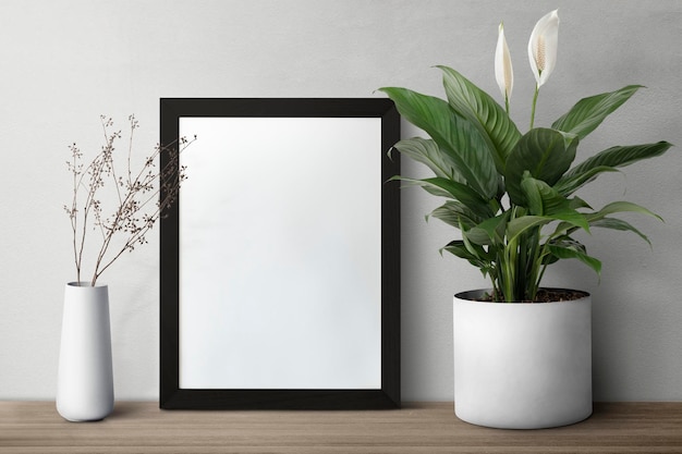 Dark modern picture frame on a shelf