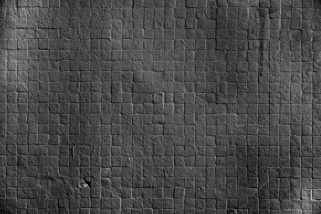 Dark square brick wall