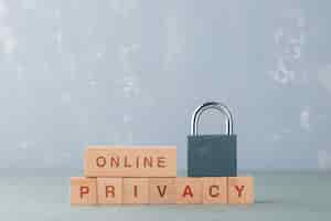 Free photo data privacy concept with wooden blocks with words, lock on it side view.