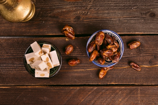 Dates fruit in bowl with Turkish delight 