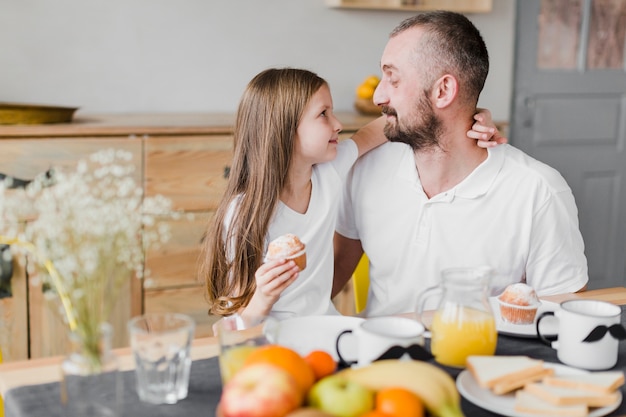 Daughter and dad at breakfast on fathers day