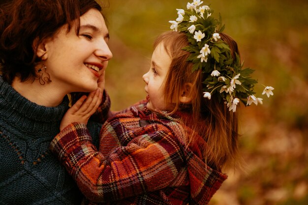 The daughter embracing her mother in the park 