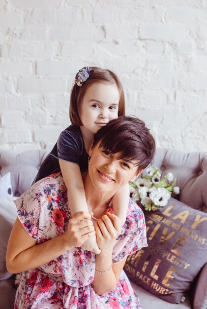 The daughter embracing her mother in the room 