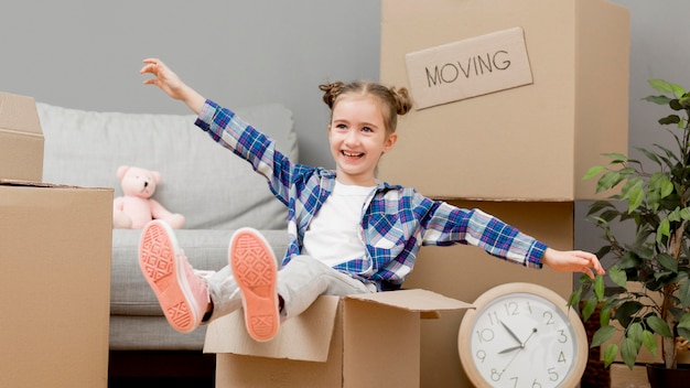 Daughter helping packing the boxes