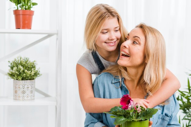 Daughter hugging mother