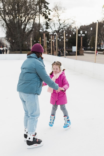 Daughter and mom holding hands