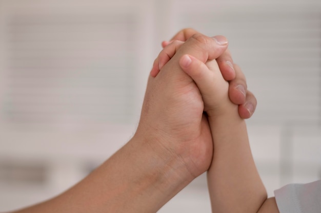 Free Photo daughter and mom holding hands