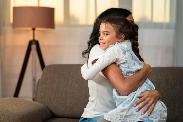 Daughter and mother hugging