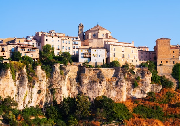 Day picturesque view of houses on rock in Cuenca